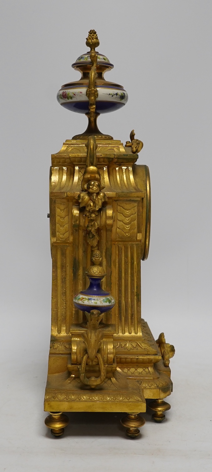 A late 19th century French ormolu mantel clock, MR and Co. Ernest Viroy, with key and pendulum, 39cm